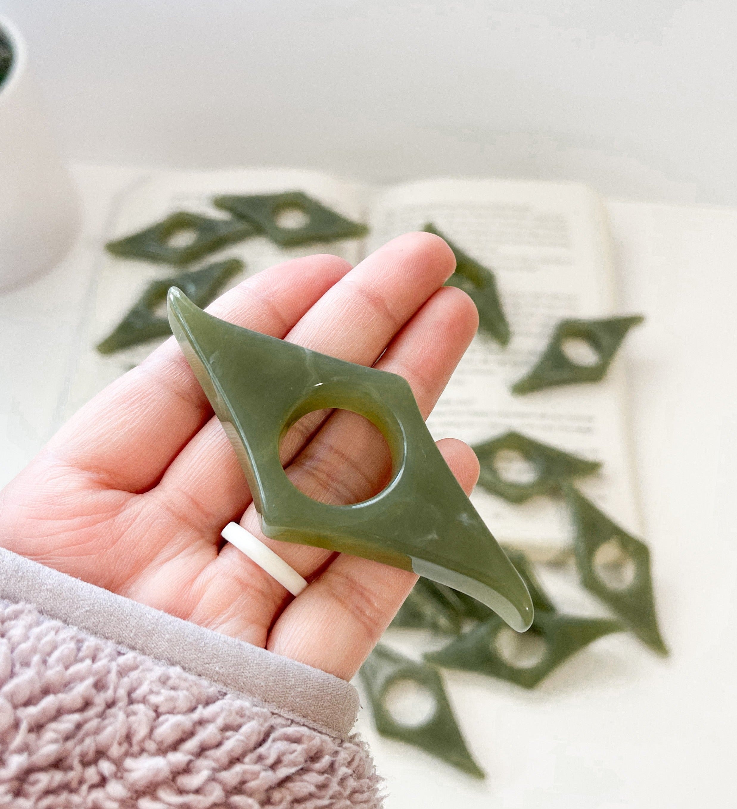 Jade green book page holder, front view,