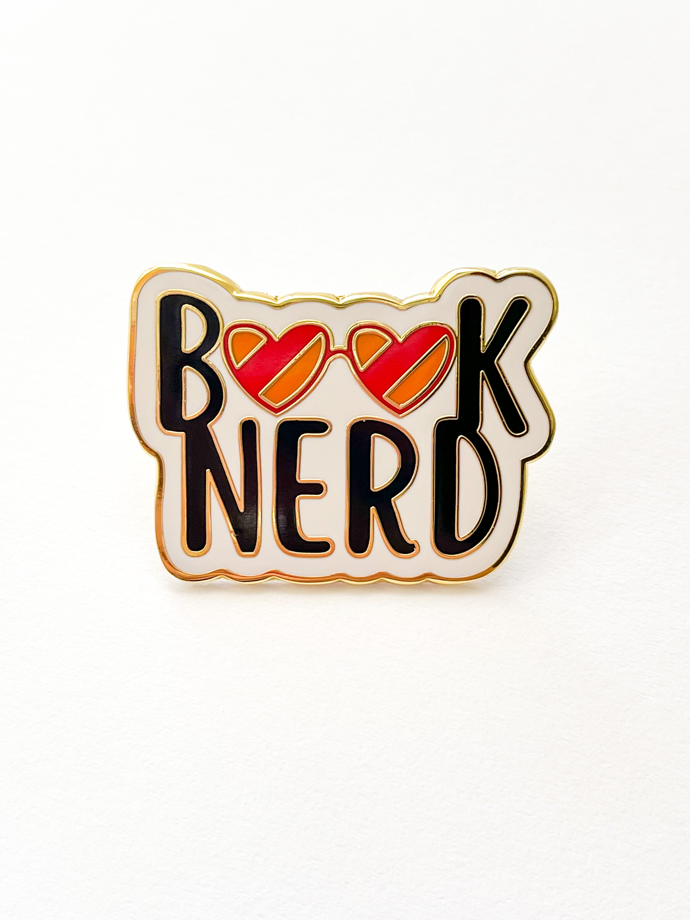 Book Nerd enamel pin, front view, black and red